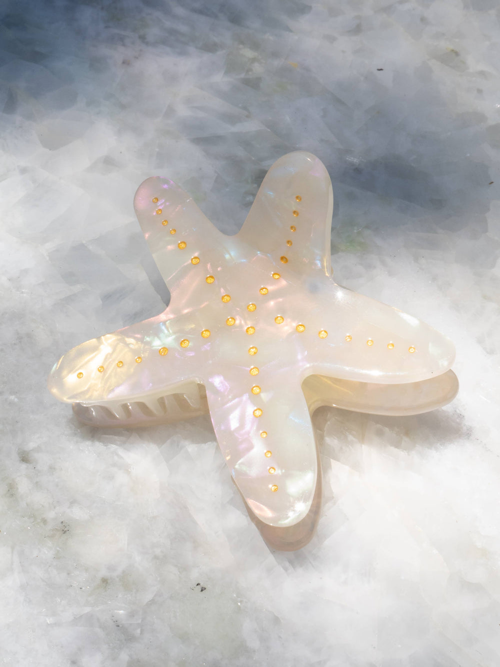 Starfish-shaped hair clip with gold accents