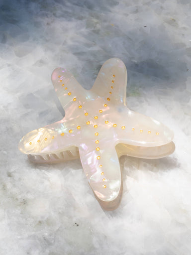 Starfish-shaped hair clip with gold accents