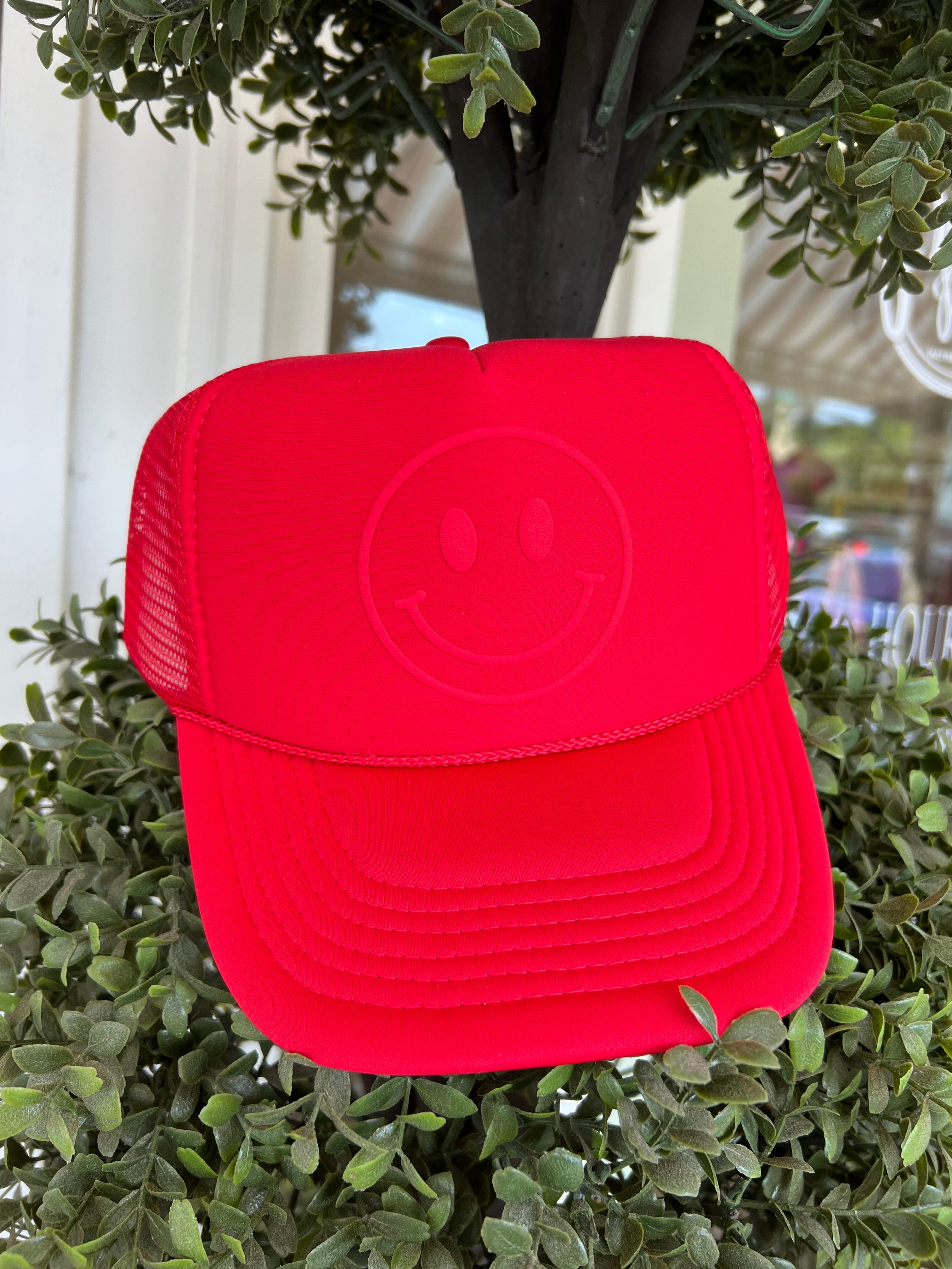 Happy Face Monochrome Trucker Hat in Red