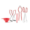 Set of red kitchen tools including a funnel, tongs, and ladle on a white background