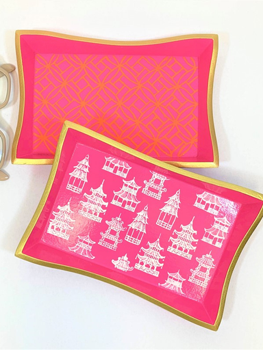 Pink trays with gold edges and white designs 