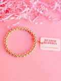 A gold-filled beaded bracelet with 6mm gold beads