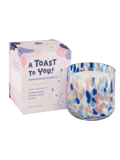 Fragranced candle with abstract design and packaging labeled 'A Toast to You!'