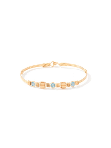 gold wire bracelet with blue beads