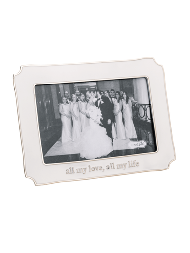 Silver photo frame with a wedding photograph inside on a white background