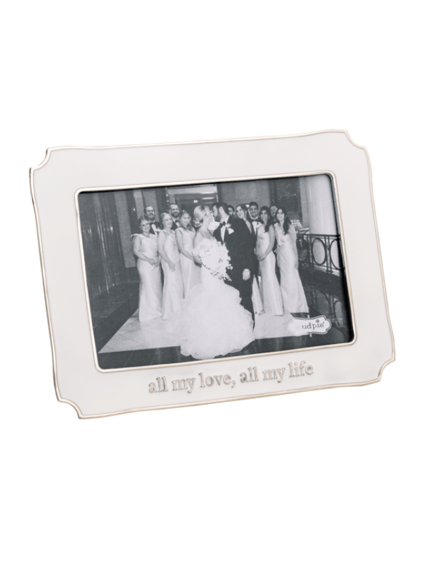 Silver photo frame with a wedding photograph inside on a white background