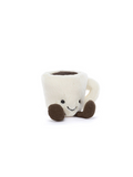 A small plush coffee mug toy with a cream-colored body, dark brown handle and feet, and a simple embroidered smiley face, photographed on a clean white background.