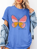 Person wearing a blue t-shirt with a butterfly graphic and 'ANTISOCIAL' text.