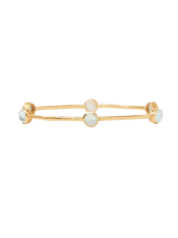 Gold bracelet with aquamarine beads on a white background