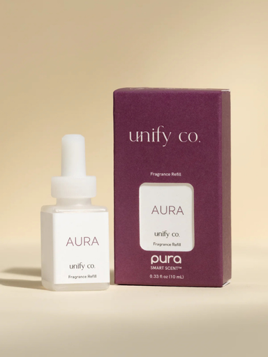Pura scent with notes of apple, bergamot, cardamom, geranium, magnolia mashpi, tonka bean, vanilla, and cedar