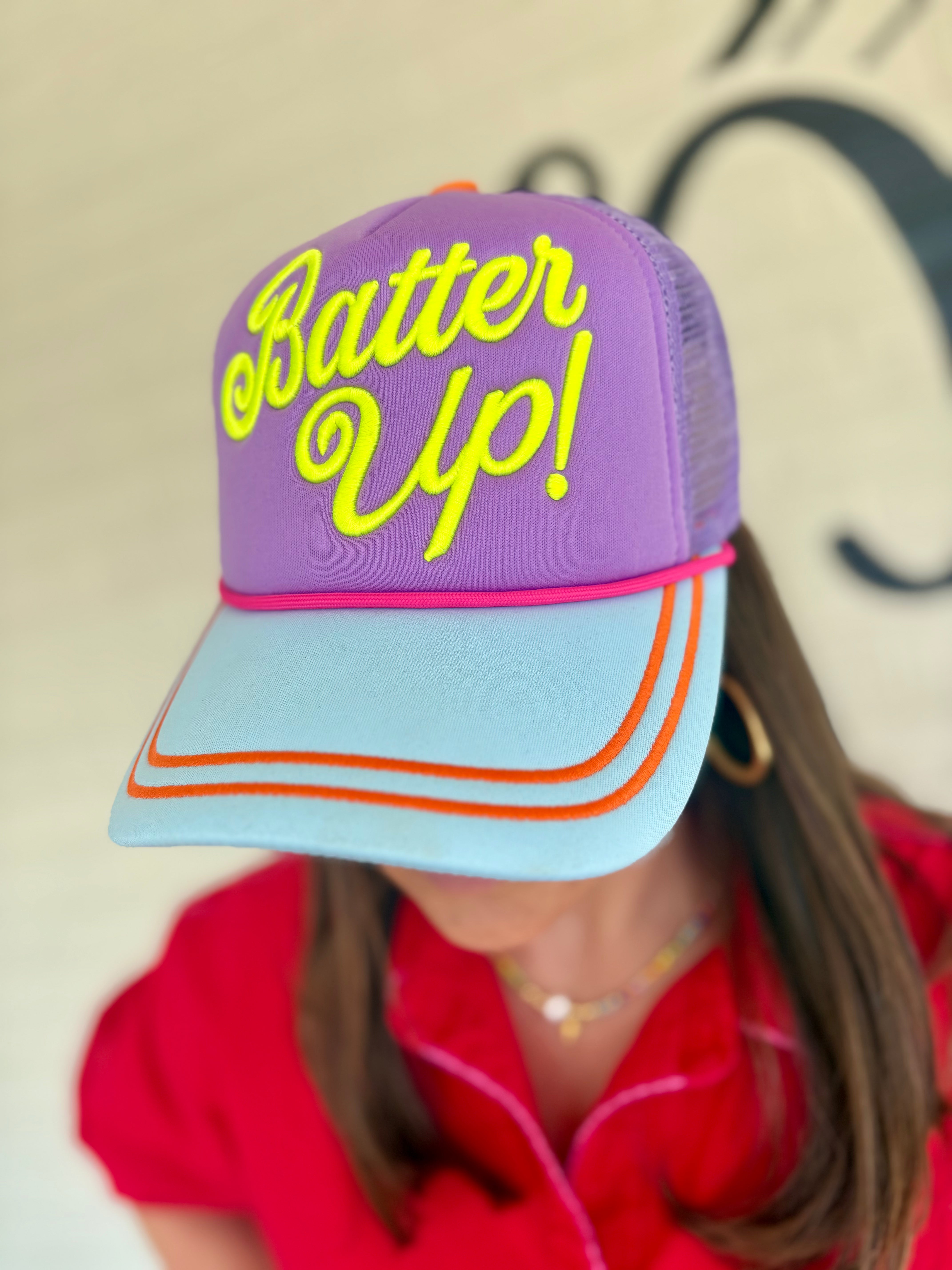 Purple and blue cap with 'Batter Up!' text neon baseball season trucker hat