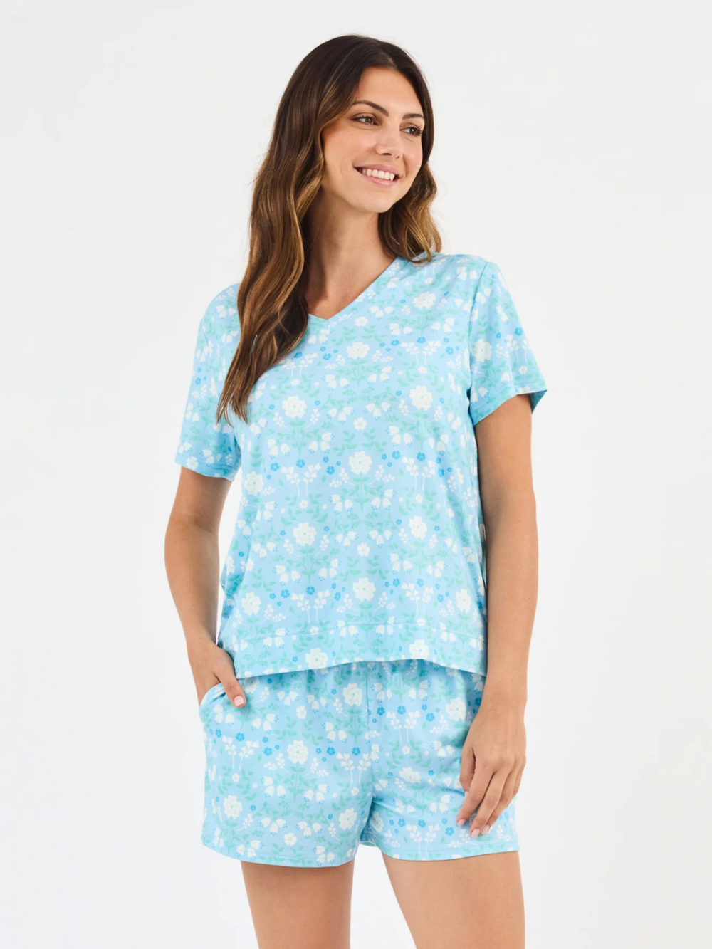 Woman wearing a light blue pajama set 