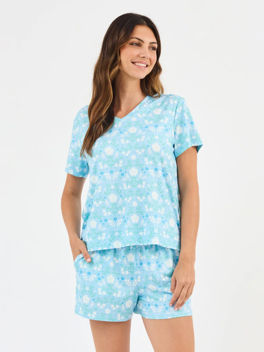 Woman wearing a light blue pajama set 