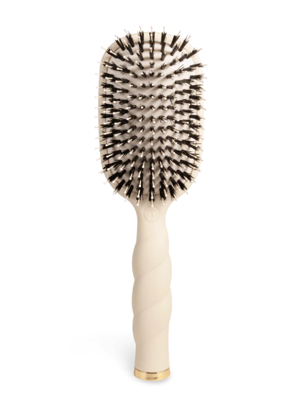 Beige hairbrush with black bristles