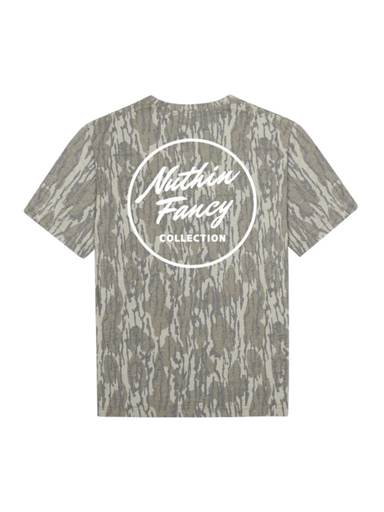 A short-sleeve t-shirt featuring mossy oak camouflage. The back of the shirt is printed with a large white circular logo that reads 'Nuthin Fancy COLLECTION'.