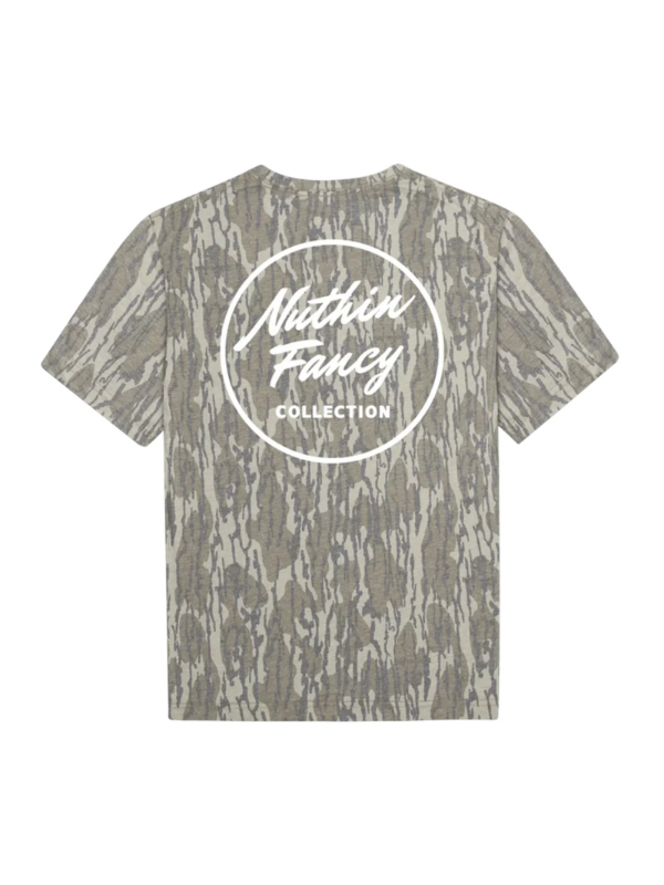 A short-sleeve t-shirt featuring mossy oak camouflage. The back of the shirt is printed with a large white circular logo that reads 'Nuthin Fancy COLLECTION'.