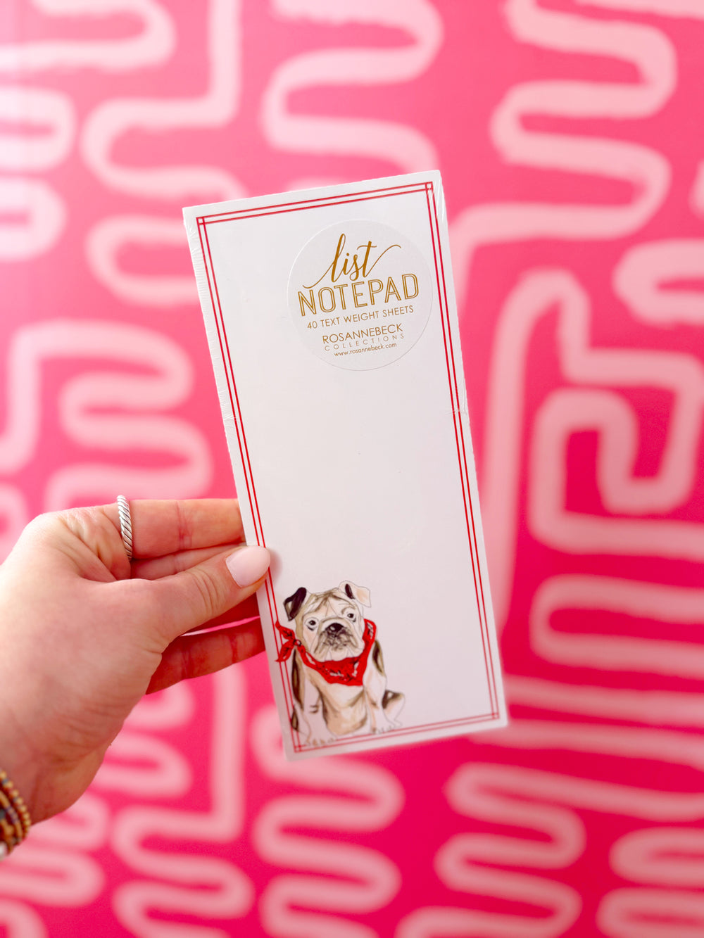 Skinny notepad with bulldog on bottom wearing a red bandana 