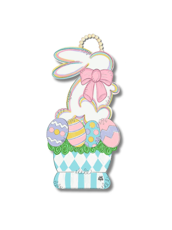 Decorative Easter door hanger with a bunny, eggs, and basket