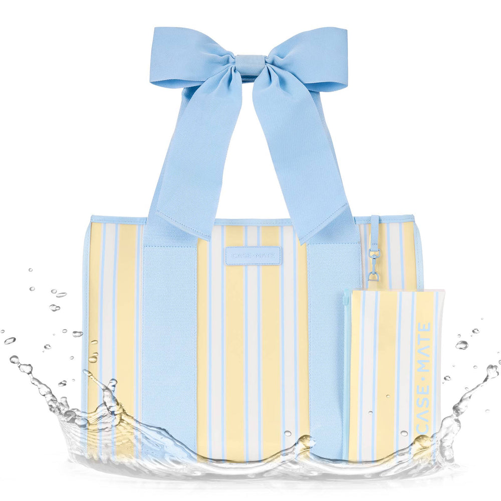 Reusable shopping bag with blue and yellow stripes and a large blue bow, partially submerged in water.