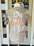 lab dog holding a shed on camo tee