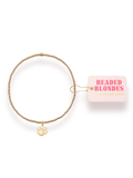 Gold beaded bracelet with a gold paw charm 