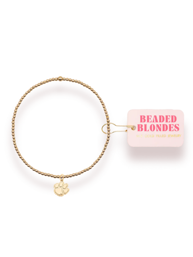 Gold beaded bracelet with a gold paw charm 