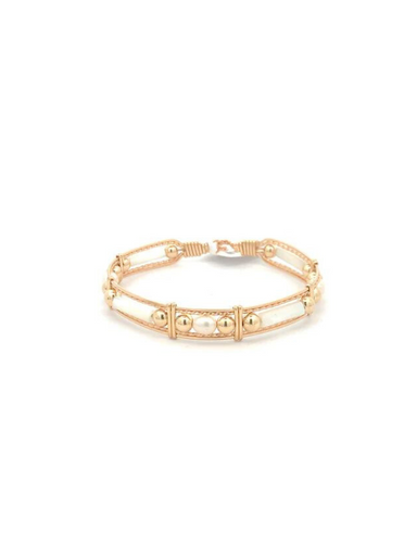 Gold bracelet on a white background