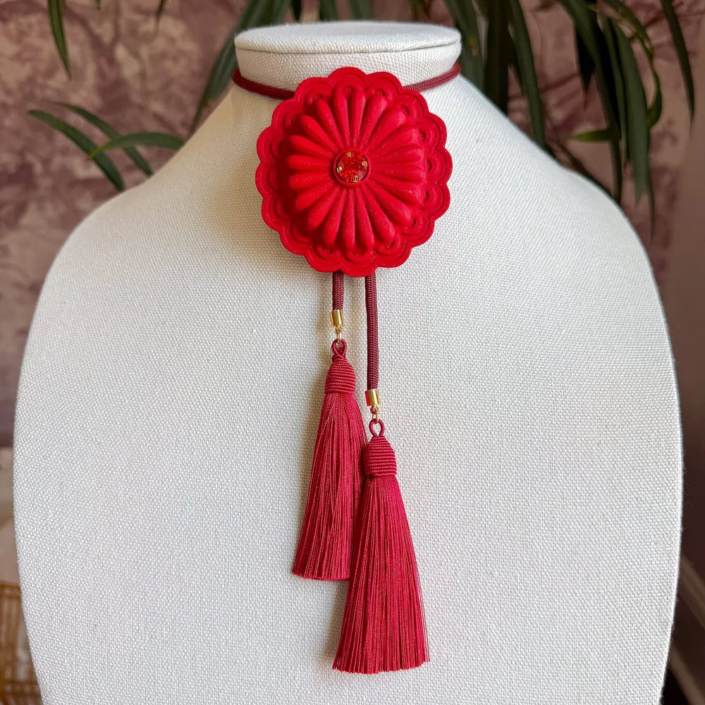 This concho bolo brings Western tradition into modern dressing — a statement piece that feels both collected and styled on purpose.