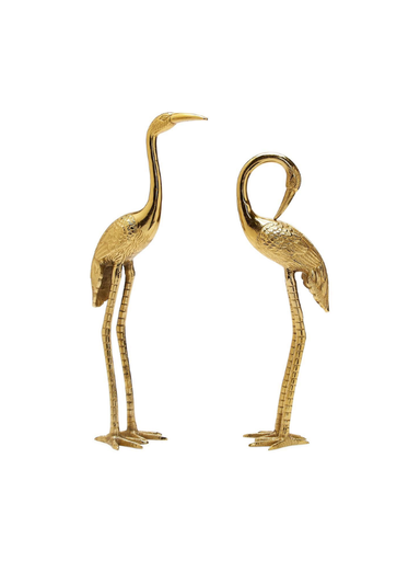 Two gold-toned decorative crane figurines with long legs and curved necks, shown side by side