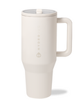 A cream-colored HydroJug Traveler 40oz tumbler with a handle and flip straw lid.