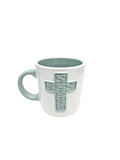 green cross on a white mug