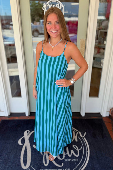 Turquoise and emerald green striped maxi dress featuring adjustable spaghetti straps, a relaxed silhouette, and a lightweight flowy design perfect for warm-weather wear.