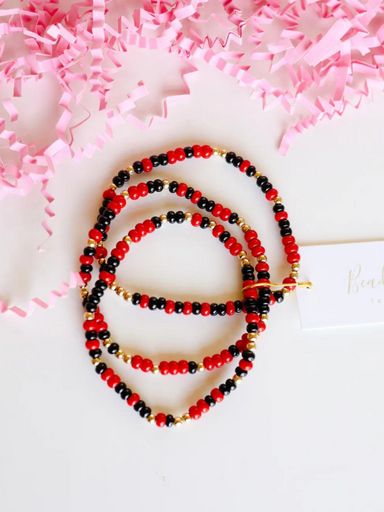 Red and black beaded bracelet with gold bead detailing