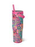 Colorful tumbler with floral design and pink lid on a white background