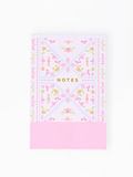 Notebook with floral design and 'Notes' text on a white background