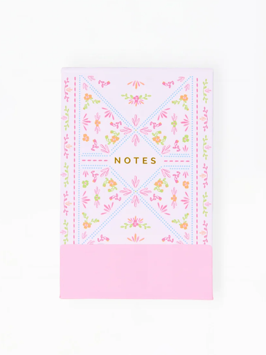 Notebook with floral design and 'Notes' text on a white background