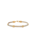 Gold bracelet with a white cord on a white background
