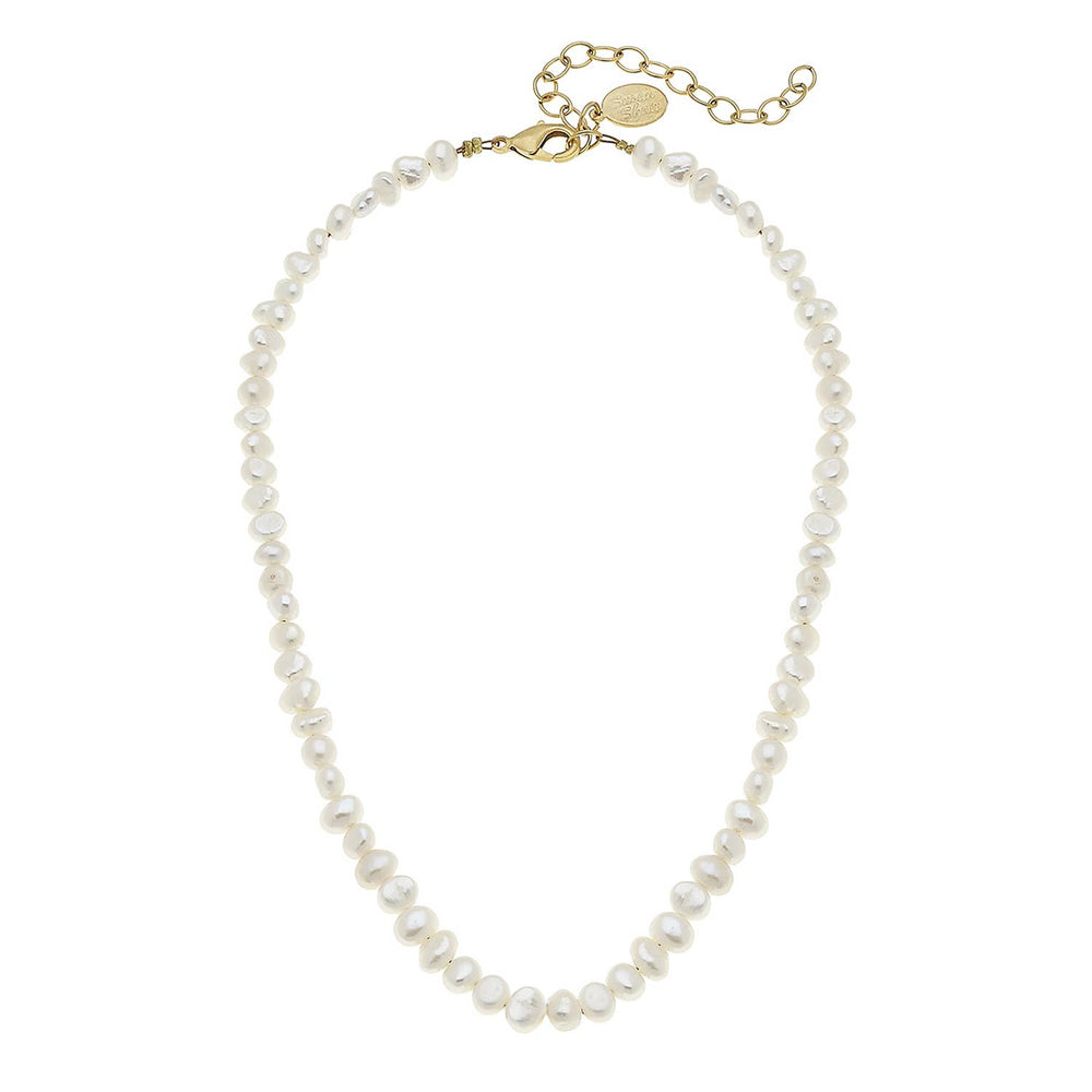 Pearl necklace with gold clasp on a white background