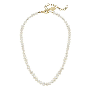 Pearl necklace with gold clasp on a white background