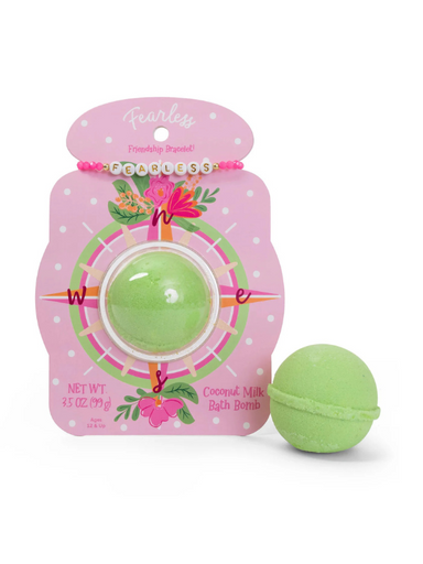 A green bath bomb with packaging that comes with friendship bracelet that says "fearless"
