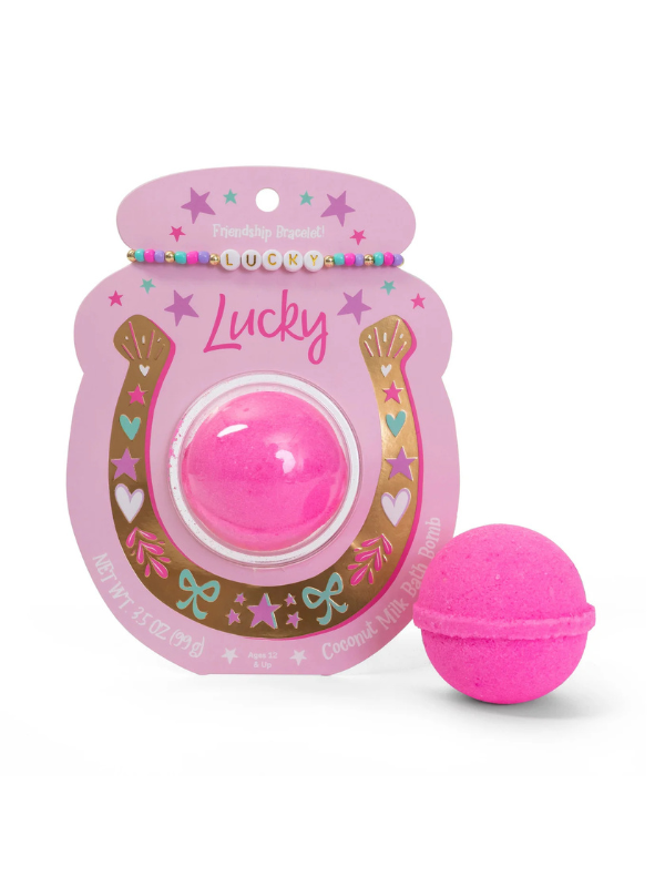 Hot pink bath bomb in packaging that comes with friendship bracelet that says "lucky"