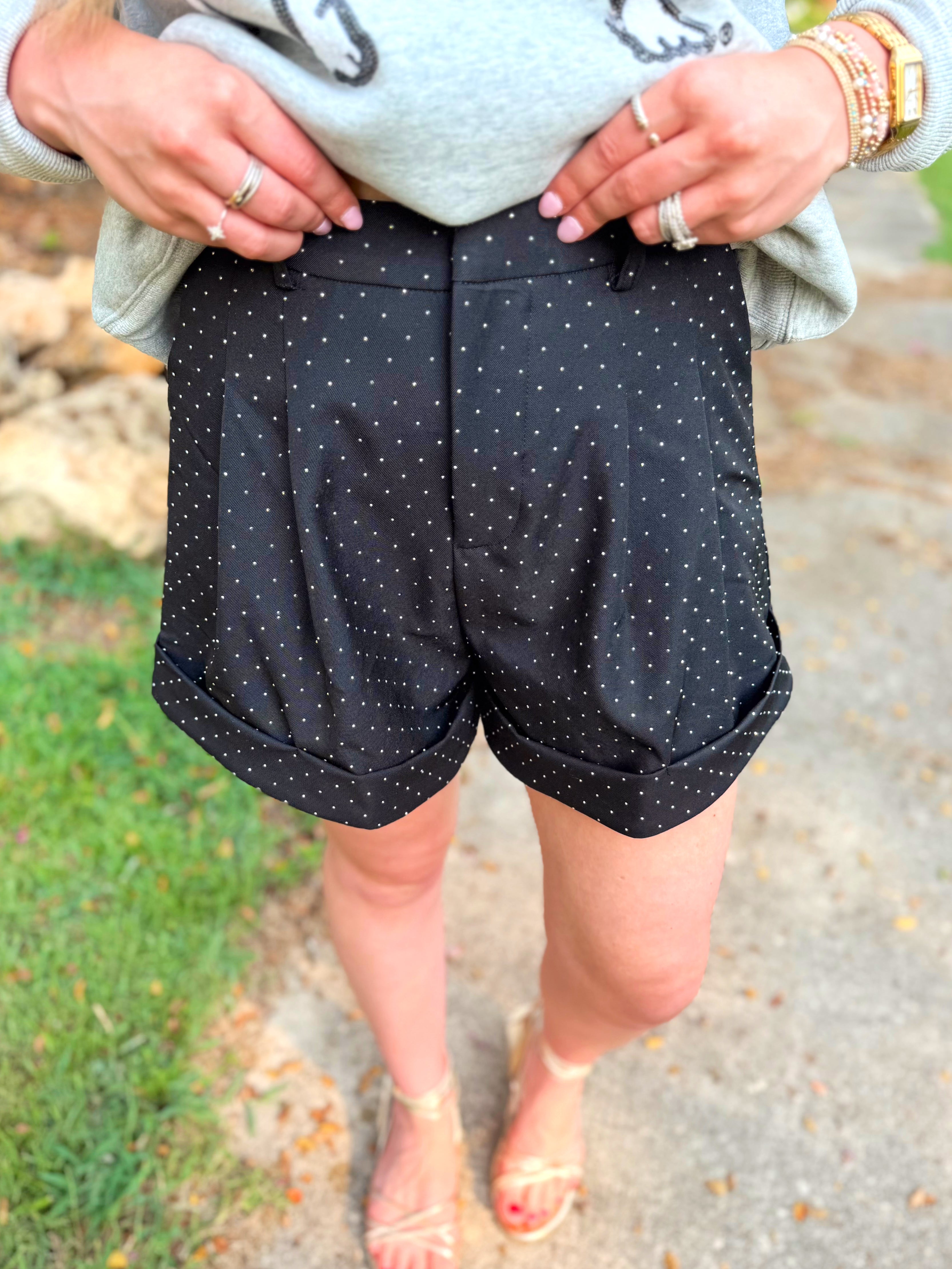 Black shorts with rhinestone sequins on them 