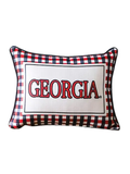 A rectangular decorative throw pillow featuring a red, black, and white gingham pattern border and a central white panel with the word 'GEORGIA' in red collegiate lettering.