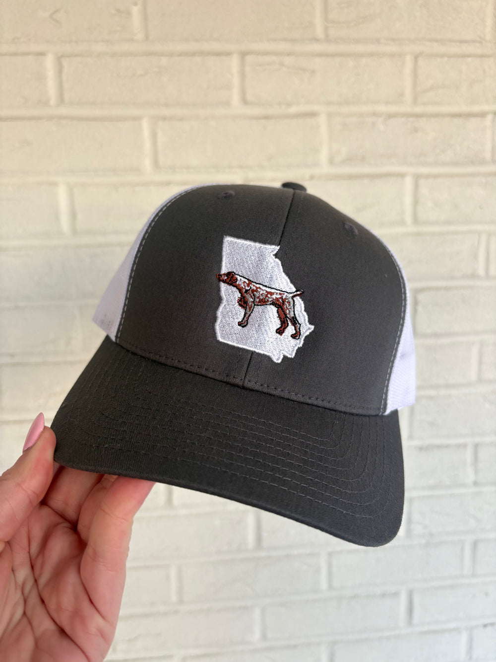Grey and white trucker hat georgia state outline with bird dog pointer embroidered detail 