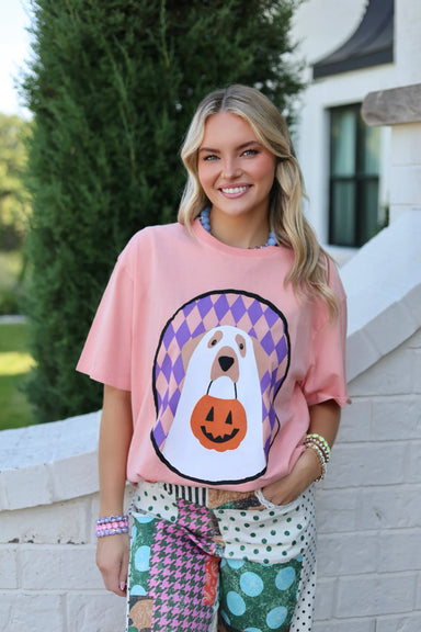 Peach colored tee with a ghost puppy holding a trick or treat basket 