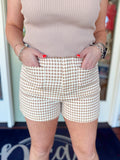 Tan and cream gingham high-waisted shorts with front patch pockets and tailored fit.
