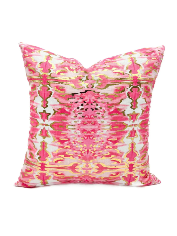 Decorative pillow with pink and gold abstract pattern
