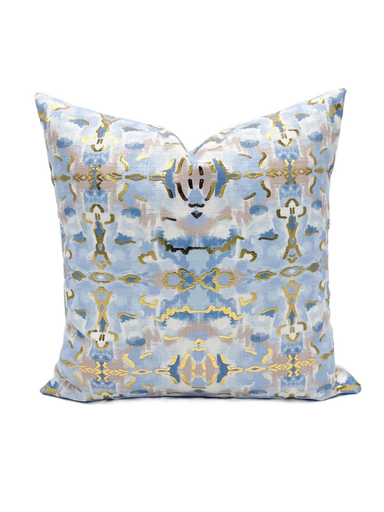 Blue and gold decorative pillow with a geometric pattern on a white background