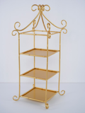 Gold metal 3 tiered display with a decorative top