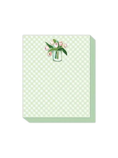 Notebook with floral design on a green gingham background